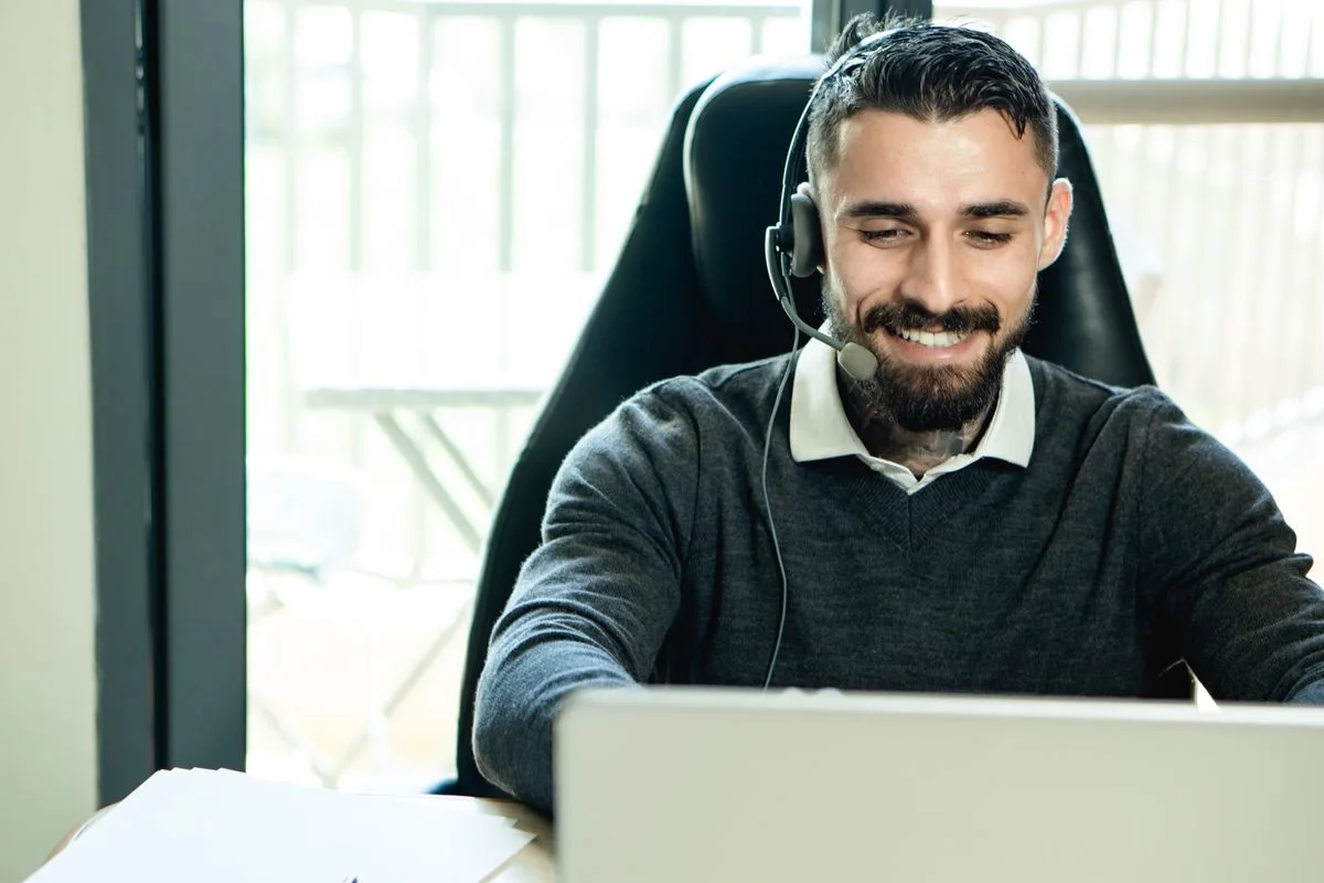 Professional working with a headset; illustrative language-services photograph