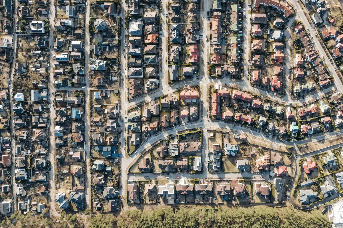 Aerial residential neighborhood; illustrative real-estate photograph