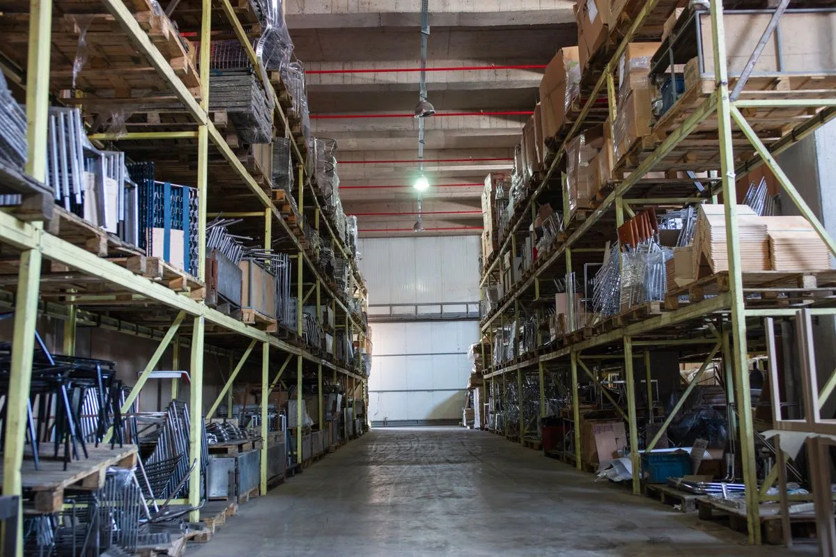 Industrial materials organized on warehouse shelving; illustrative supply-distribution photograph